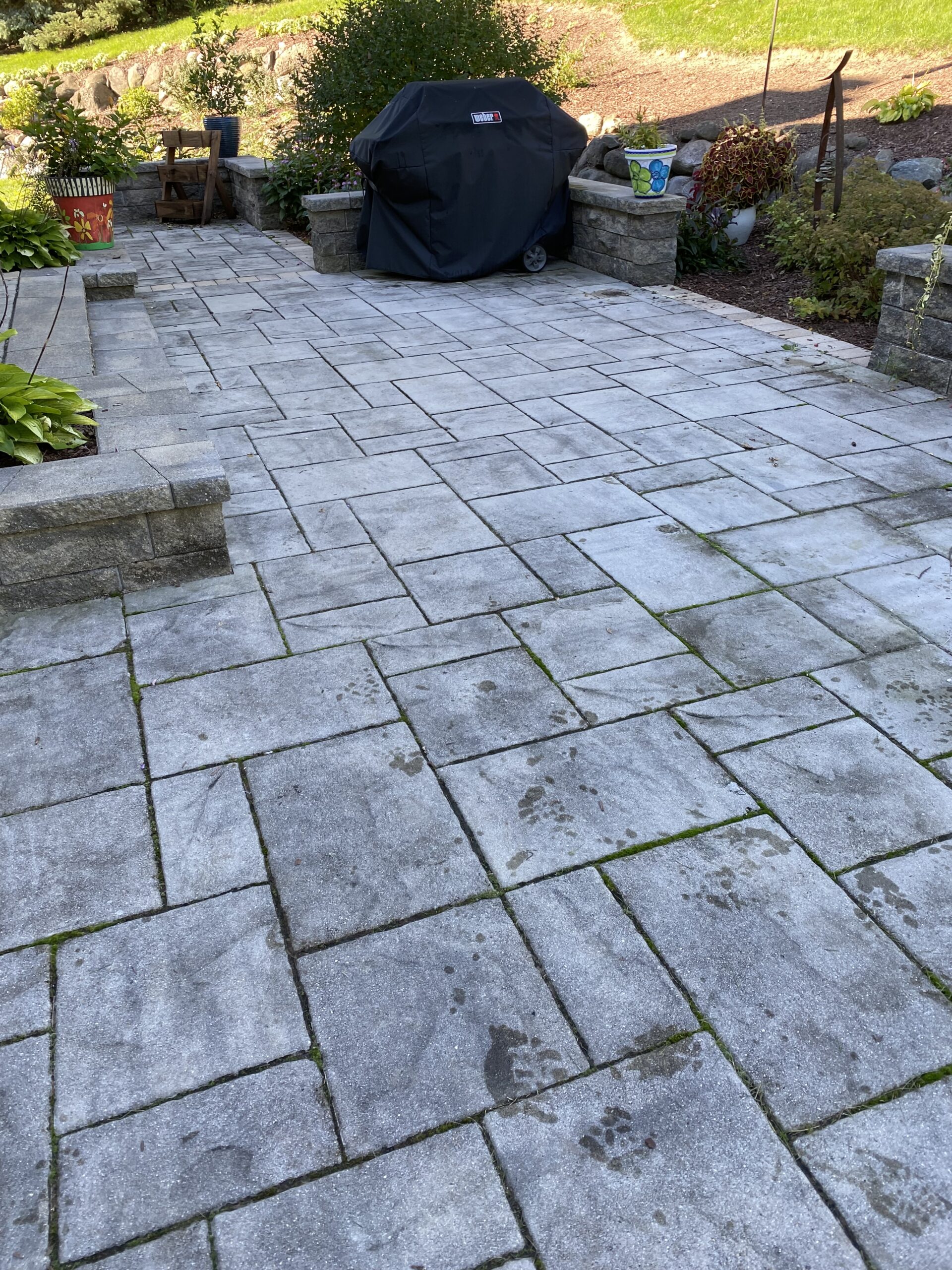 Before window cleaning project showcasing patio cleaning results by Blueline Cleaning Services.